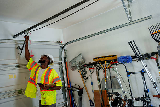Professional Garage Door Panel Replacement technician working in Columbus Junction, IA